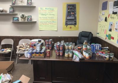 Cans and boxes of food on a table.