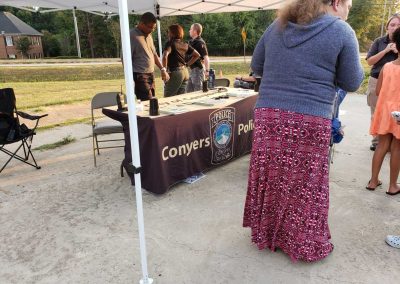 Conyers police table under a canopy