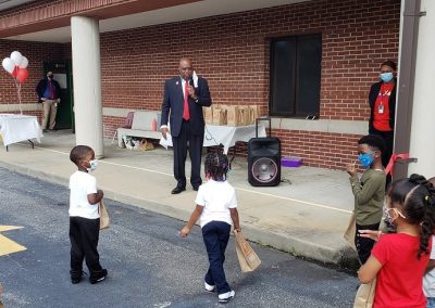 The Mayor addressing a group of seven children.